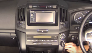 Remove the padded covers from the two sides of the lower section at the center of the dash