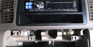 Underneath the original car radio, there are four screws, just remove them so as to take out the original car radio